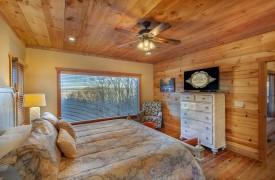 High Hopes | Cabin Rentals of Georgia | King Master Suite on Main Level with extra large picture window overlooking north ga mountain views