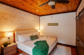 The River's Edge | Cabin Rentals of Georgia | Main-floor King bedroom featuring a private ensuite bathroom in Blue Ridge, Georgia