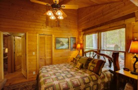 Creekside Green | Cabin Rentals of Georgia | Master Queen Suite with TV and Ensuite Bathroom