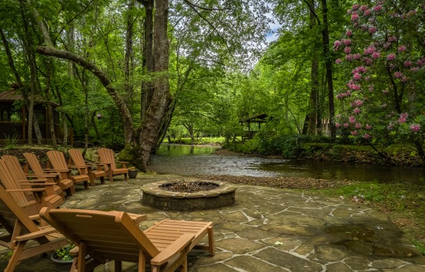 Creekside Green | Cabin Rentals of Georgia | Stunning Fire Pit and Seating on the Edge of Fightingtown Creek